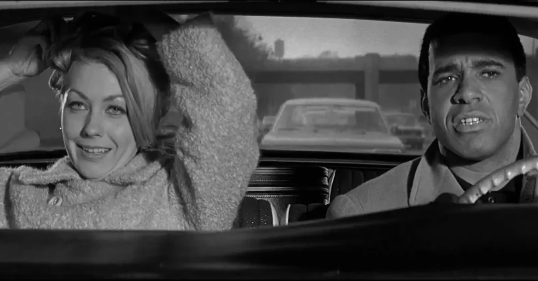 Judi West y Ron Rich como Sandy y Boom Boom Jackson